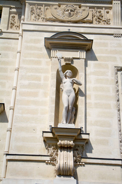 Architectural details and statues on the wall of the Palais de Justice in Paris - Photo, Image