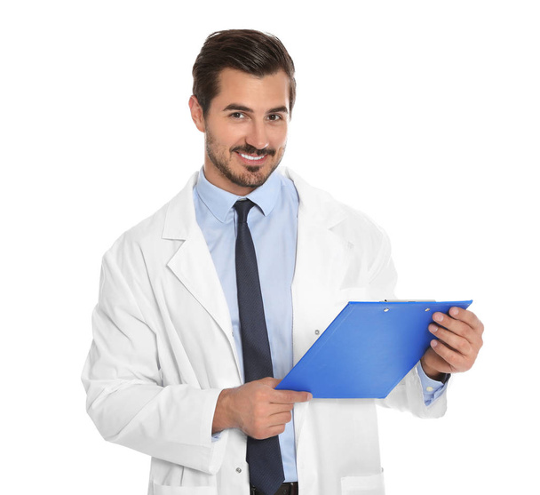 Young male doctor with clipboard on white background. Medical service - Photo, image
