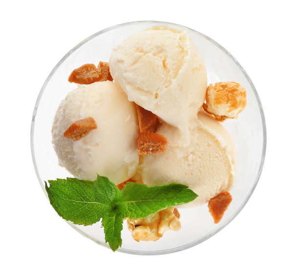 Delicious ice cream with caramel candies and popcorn in dessert bowl on white background, top view - Φωτογραφία, εικόνα