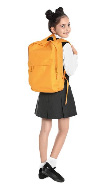 Happy girl in school uniform on white background - Φωτογραφία, εικόνα