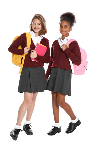 Happy girls in school uniform on white background - Foto, Imagem