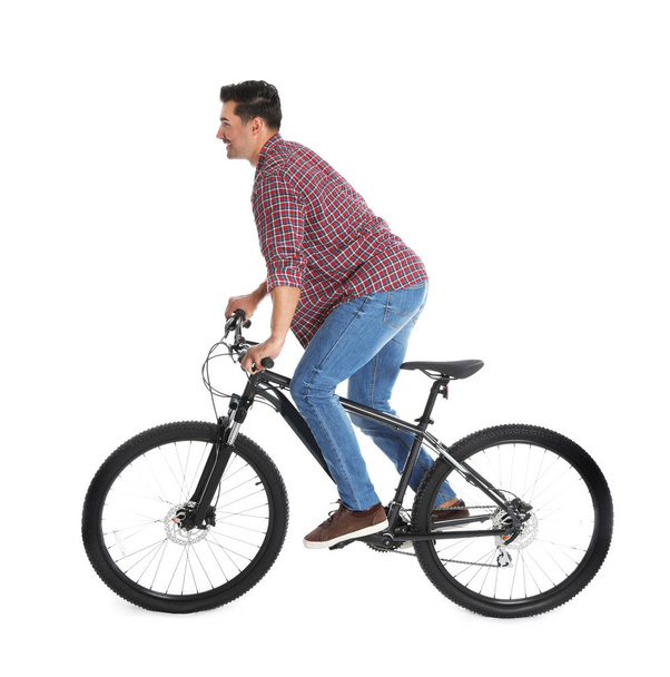 Handsome young man with modern bicycle on white background - Foto, Imagem