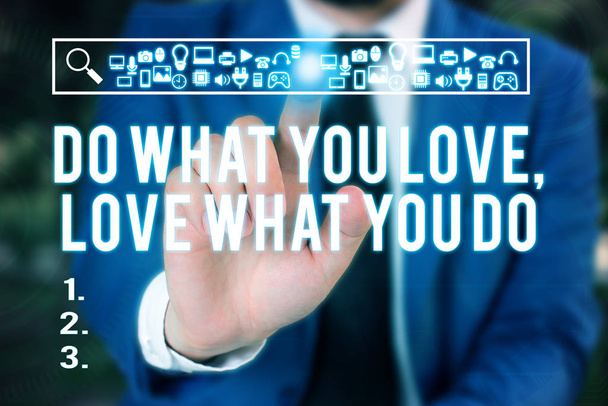 Word writing text Do What You Love Love What You Do. Business concept for Pursue your dreams or passions in life Male human wear formal work suit presenting presentation using smart device. - Photo, Image