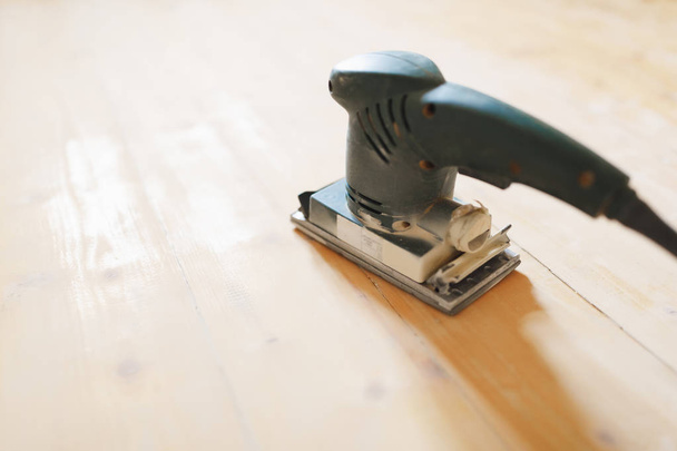 wooden floor sanding with flat sander tool - Photo, Image