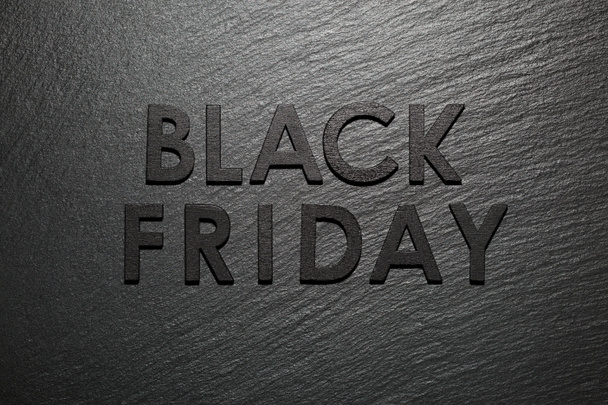 Black Friday text on black slate background - Foto, immagini
