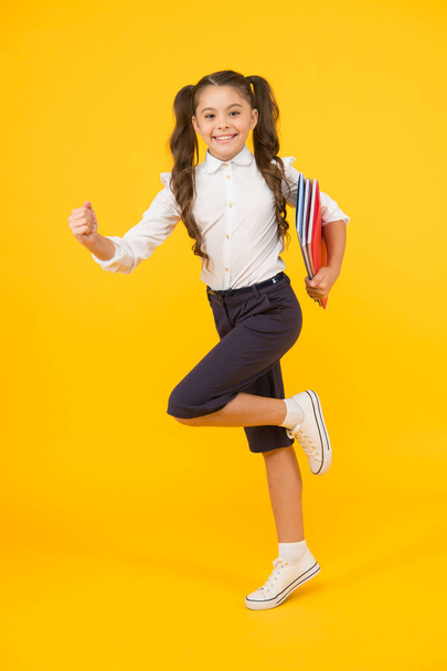Hurry up. Keep going. Active kid. Girl with books on way to school. Knowledge day. Back to school. Kid cheerful schoolgirl running. Pupil want study. Active child in motion. Beginning school lesson - Фото, изображение