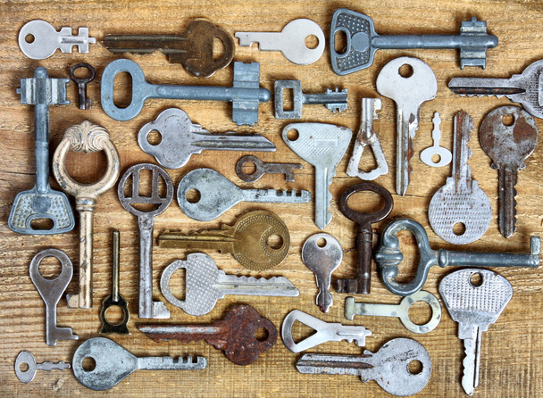 Old keys on wooden background - Photo, Image