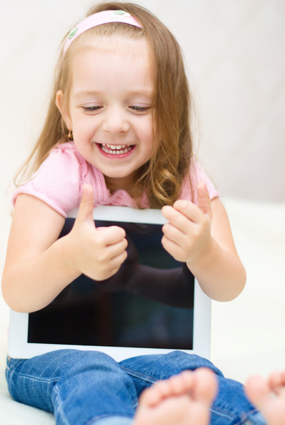 little girl with tablet computer - Фото, изображение