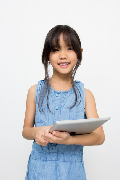 Happy Asian child with tablet computer - Фото, зображення
