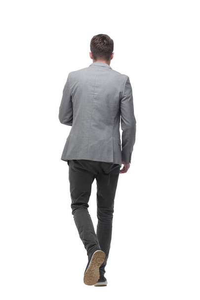 modern young man stepping forward. isolated on white - Φωτογραφία, εικόνα
