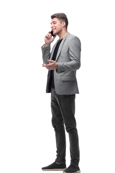 smiling man talking on his smartphone . isolated on white - Foto, Imagem