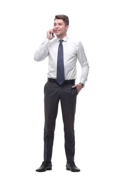 successful young businessman talking on mobile phone. isolated on white - Foto, Bild