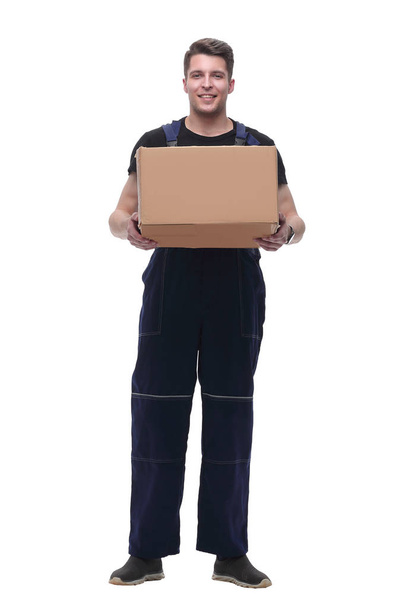 man in overalls with a cardboard box. isolated on white - Photo, Image