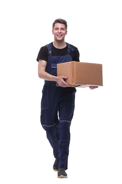 friendly worker with cardboard box stepping forward. isolated on white - Zdjęcie, obraz
