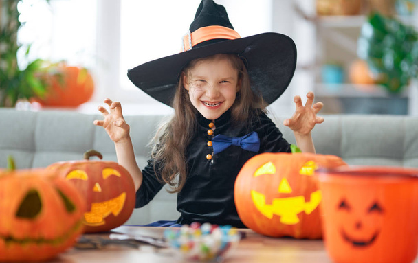little laughing girl in witch costume - Φωτογραφία, εικόνα