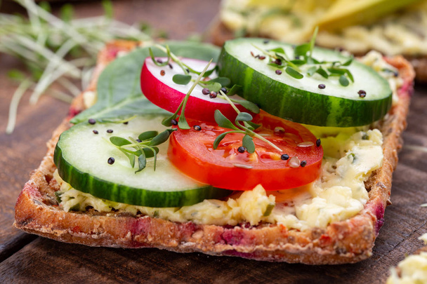 Sandwiches with cream cheese, vegetables and salami. - Photo, image