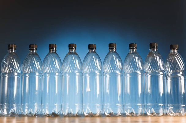 empty plastic bottles on blue background - Photo, Image