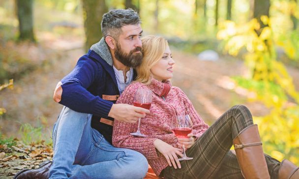 camping and hiking. cheers. Family picnic. Valentines day. happy woman and man drink wine. couple in love relax in autumn forest. love date and romance. Spring mood. Enjoying good time with friends - Фото, зображення