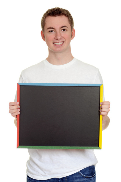 Teen boy holding chalk board - Foto, Imagen
