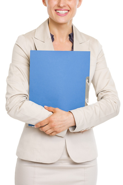 Closeup on smiling business woman holding folder - Foto, afbeelding