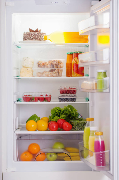  white fridge with different food - Foto, Imagen