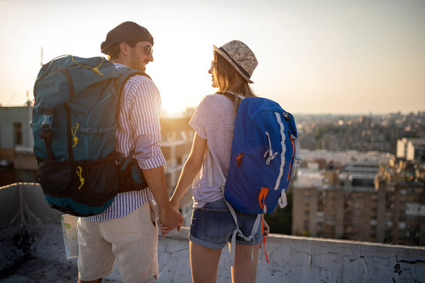 Young couple traveling with a map in the city - Photo, image
