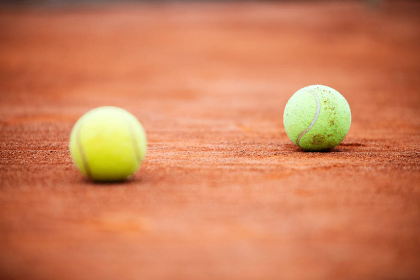 Close up of tennis balls on tennis court - Φωτογραφία, εικόνα
