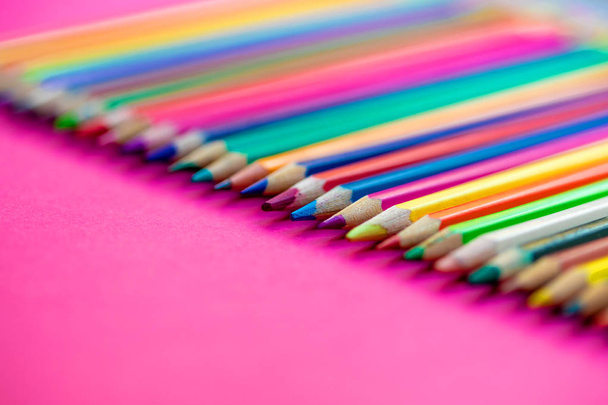 Colored pencils in a  row on a pink  background. Back to school  - Φωτογραφία, εικόνα