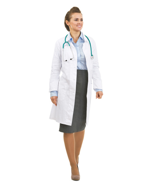 Smiling doctor woman going straight and looking on copy space - Photo, Image