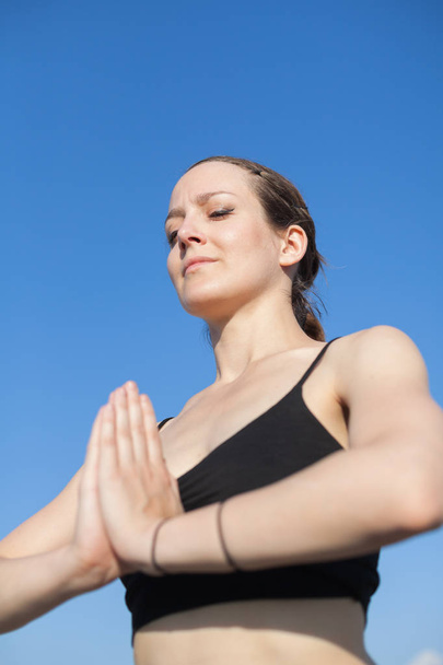 portrait of a young woman doing yoga - Foto, imagen