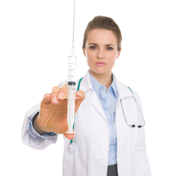 Closeup on doctor woman holding syringe - Photo, image