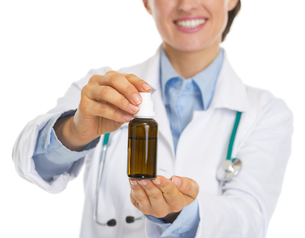 Closeup on medicine bottle in hand of doctor woman - 写真・画像