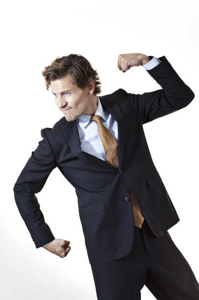 Strong businessman showing off - Photo, Image