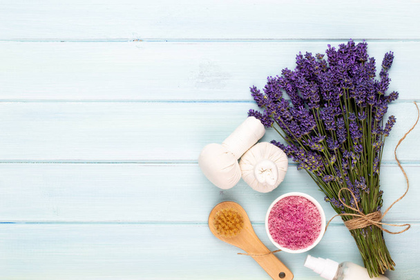 Grooming products and fresh lavender bouquet on white wooden tab - Photo, Image