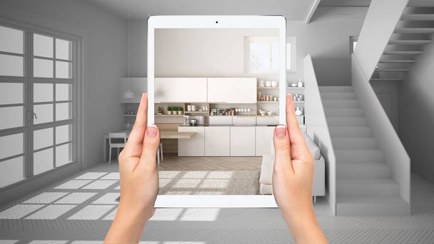 Kädet tilalla tabletti osoittaa moderni valkoinen ja puinen keittiö, yhteensä tyhjä projektin tausta, täydennetty todellisuus käsite, sovellus simuloida huonekaluja ja sisustustuotteita
 - Valokuva, kuva