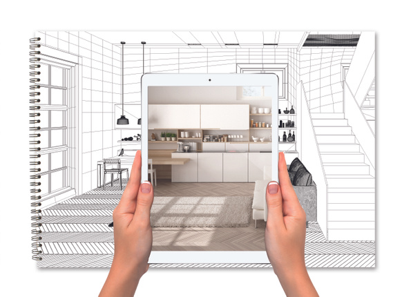 Руки держат планшет, показывающий кухню, ноутбук с эскизом чертежа на заднем плане, концепцию дополненной реальности, приложение для имитации мебели и изделий интерьера - Фото, изображение
