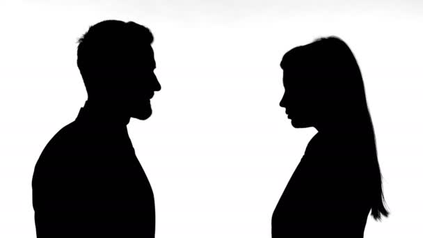 Silhouette of Man Slapping Woman Against White Background - Footage, Video