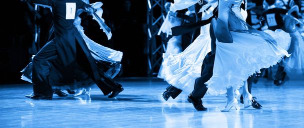 woman and man dancer latino international dancing. Blue filter - Photo, Image
