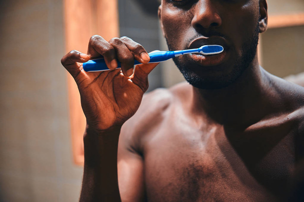 Concept of mourning routine - man is brushing his teeth - Φωτογραφία, εικόνα