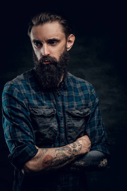 Portrait of dolorous bearded man at studio - Photo, Image