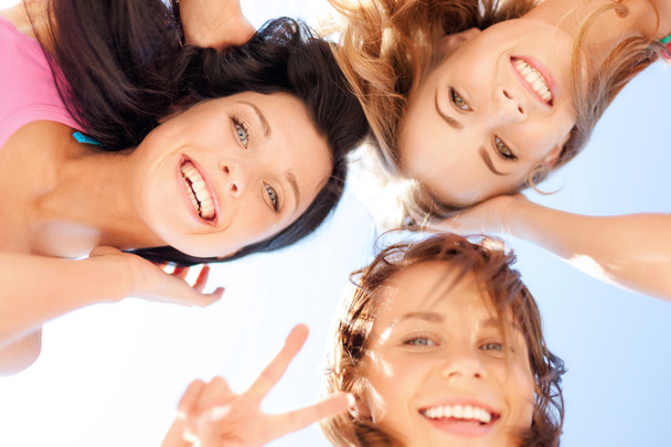 Girls faces with shades looking down - Фото, зображення