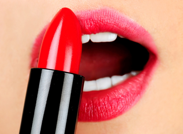 Woman applying lipstick - Photo, Image