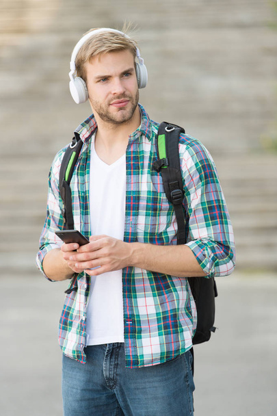 College life. College student headphones smartphone. Online course. Audio book concept. Educational technology use physical hardware software and educational theoretic. College education concept - Fotó, kép
