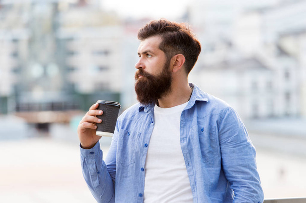 Great ideas come from great coffee. Man drink take away coffee. Morning coffee. Mature hipster enjoy hot beverage. Bearded man relax outdoors. Coffee break concept. Caffeine addicted - 写真・画像