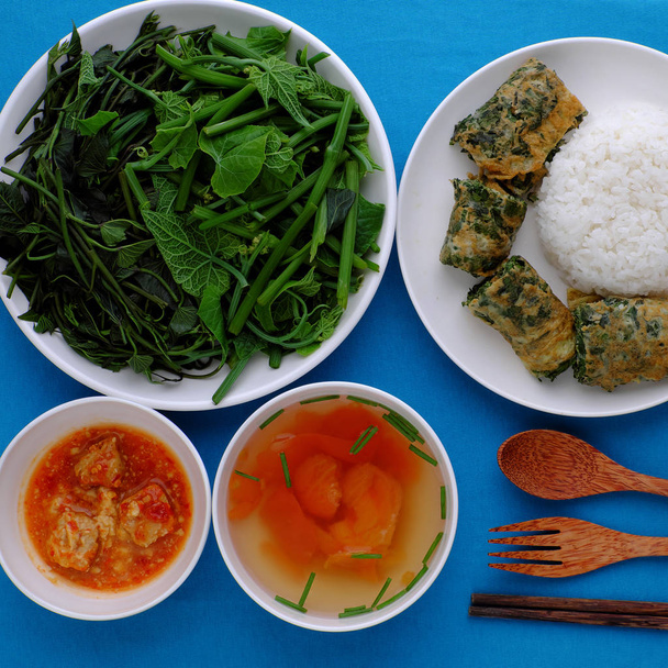Vietnamese meal, boiled vegetables, tofu cheese, tomato soup, fr - Photo, Image