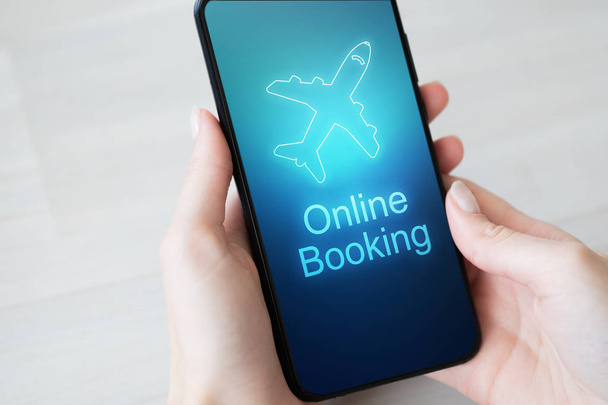 Flight booking application on mobile phone screen. Business and technology concept. - Photo, Image