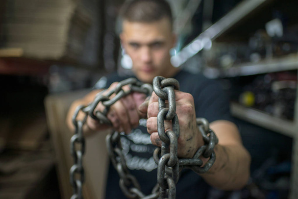  man with chain hand - Zdjęcie, obraz