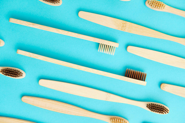 Wooden Toothbrush Isolated on Blue Background Copy Space - Foto, imagen
