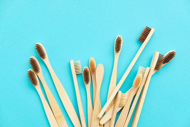 Wooden Toothbrush Isolated on Blue Background Copy Space - Фото, изображение
