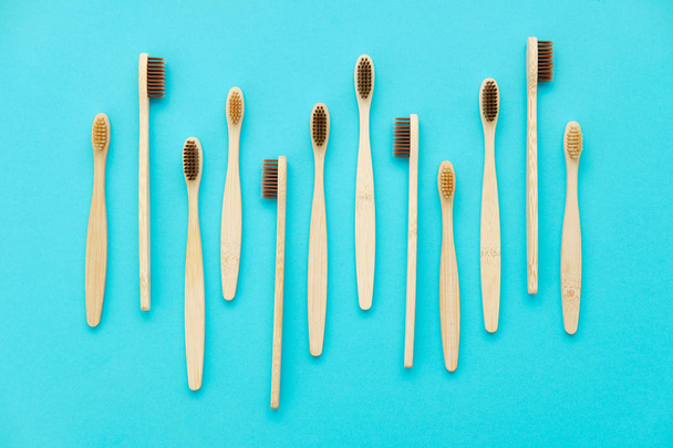 Wooden Toothbrush Isolated on Blue Background Copy Space - Foto, immagini